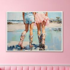 two women in short skirts and cowboy boots walking on the beach with their feet up