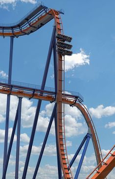 a roller coaster in the sky on a sunny day