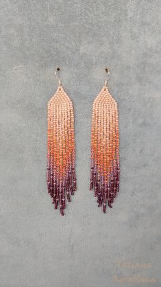 These unique handmade earrings are made of high-quality Czech beads and strong synthetic thread. They are elegant, fashionable, and highly versatile, suitable for everyday wear. Color: orange,coral, purple . There may be some color discrepancies which is due to the different monitor settings I will make these earrings for you in your favorite size. 100% hand made with love! Measurements: Length-about  12cm (4.7 inch) Width -about  2 cm (0.79 inch) Materials: Sterling silver components Czech glass beads Strong bead weaving thread Summer Orange Earrings With Tiny Beads, Handmade Purple Beaded Earrings For Beach, Orange Beaded Drop Earrings, Orange Beaded Fringe Earrings With Round Beads, Handmade Orange Tassel Earrings For Summer, Orange Beaded Fringe Jewelry, Orange Fringe Earrings, Handmade Purple Tassel Earrings With Round Beads, Summer Orange Beaded Fringe Earrings