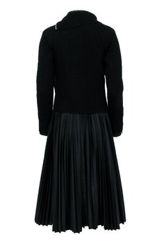 Embrace the dark side with this unique Sacai pleated dress, featuring a versatile detachable hoodie, and a long-sleeve pleated dress for a touch of gothic flair. Pair with chunky combat boots and statement accessories for an edgy head-turning ensemble. Size 2 Dress Shell 65% Polyester 35% Cotton Hoodie Shell 100% Wool Unlined Detachable hoodie Long sleeves Pleated throughout Bust 33” Waist 38” Sleeve length 24.5” Shoulder to hem 47” Shoulder to shoulder 15.5” Black Long Sleeve Dress With Pleated Skirt, Winter Pleated Dress For Work, Elegant Black Pleated Dress For Fall, Black Pleated Dress For Fall, Fall Long Sleeve Dress With Accordion Pleats, Fall Dresses With Accordion Pleats And Long Sleeves, Fall Evening Pleated Fitted Dress, Evening Pleated Dress For Fall, Fitted Pleated Evening Dress For Fall