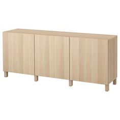 the sideboard is made from wood and has three doors