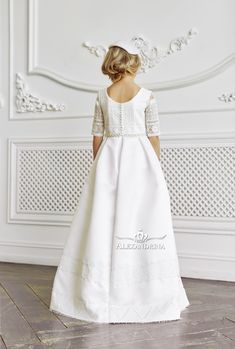 Elegant dress with lace decoration for true ladies. The designer outfit in a milky shade. The bodice with short sleeves is decorated with handmade lace trim. The waistline is slightly raised and highlighted by a decorative pearl belt. A straight skirt at the waist is gathered in large opposite folds, fringe along the bottom. The decor is two stripes of lace. #flowergirldress #princessdress #communiondress Tulle Cape, Pearl Belt, Holy Communion Dresses, Designer Outfit, First Communion Dress, First Communion Dresses, Communion Dresses, Lace Decor, Handmade Lace