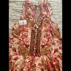 Gorgeous Brand New And Perfect For Summer Or Fall Free People Mini Dress With Ruffle Along Hemline And Ties In The Back. The Color Is Pink Combo On An Ecru Backgroundit’s Beautiful! Nwt. Can Also Be Worn As A Tunic With Leggings. Pink Ruffled Dress For Festival, Pink Sleeveless Boho Print Dress, Sleeveless Ruffled Maxi Dress For Festivals, Pink Boho Print Dress For Garden Party, Pink Printed Festival Dress, Pink Floral Print Dress For Festival, Pink Boho Print Summer Dress, Tunic With Leggings, Tunics With Leggings