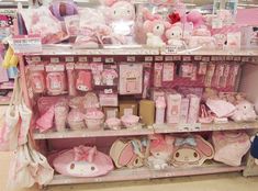 there are many items on the shelves in this store, including teddy bears and other toys