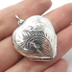 925 Sterling Silver Vintage Engraved Heart Locket Pendant  Weight: 16.9g   WELCOME TO PAWN SHOP We are an actual pawn shop and have been in business for over 25 years. Since 1990, our establishment has been serving a variety of clients by providing them with short term cash solutions and options of liquidity regarding their treasured heirlooms. Acknowledging that today′s customers are very sophisticated and are looking for a variety of investments, our acquisitions are hand-picked for our specia Classic Engraved Heart Jewelry, Engraved Sterling Silver Heart Cut Jewelry, Classic Heart Jewelry For Collectibles, Silver Heart Jewelry Stamped 925, Engraved Heart Cut Sterling Silver Jewelry, Silver Heart Cut 925 Stamped Jewelry, Classic Heart-shaped Engraved Jewelry, Classic Heart Shaped Collectible Jewelry, Silver Heart Cut Jewelry Stamped 925