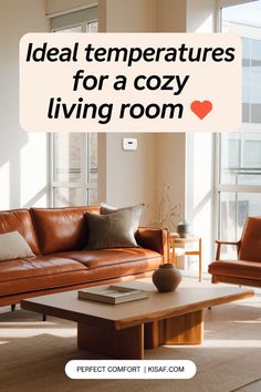 a brown leather couch sitting in front of a wooden coffee table with pillows on it