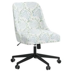 an office chair with wheels and a flower print upholstered on the backrest