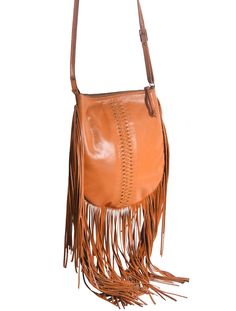 Sayang Fringe Crossbody. Beauty lies in the details and this sublime handcrafted, handwoven Crossbody bag has plenty. Our Balinese Artisans intricately weave rich soft genuine leather to create an exquisite Bohemian statement piece with the added fringe that will have heads turning. Whether at the farmers market with the kids or attending a summer festival, this decorative beauty will be your everyday companion adding a unique edge to your favorite jeans or feminine floral dress. Featuring a lea Midnight Black, Balinese, Summer Festival, Farmers Market, Favorite Jeans, Statement Pieces, Bucket Bag, Turning, Crossbody Bag