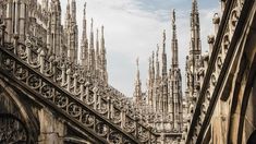 the roof of an old building with many spires