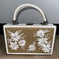 I Bought This New From Macys For $289 And Never Used It. Gorgeous Leather Flower Appliqus On From. White Wicker Is In Perfect Condition. Perfect Bag! I Also Have Some Matching Platform Heels Listed Separately. Size: 11.5”X 7.5”X 3” ***All Sales Are Final*** White Top Handle Box Bag With Original Box, White Shoulder Bag For Evening With Original Box, White Clutch Box Bag With Top Carry Handle, Designer White Rectangular Case Bag, Luxury White Box Bag With Handles, Luxury White Box Bag Shaped As Clutch, Luxury White Rectangular Case Bag, Designer White Tote Box Bag, Luxury White Rectangular Shoulder Bag