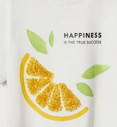 a white t - shirt with an orange cut in half and the words happiness is the true success