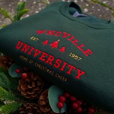 The Perfect Christmas Sweatshirt for this Winter. Best Christmas Present and Gift for family and friends! This comfortable apparel will be your and your friends' favourite! Be simple, be different! I've included images showing the design on a Forest Green Sweatshirt, please message me for specific sweatshirt colour requests/a request for changing the embroidery colour. Check out our Shop filled with so many Designs! @TahikoStitch ⬅️⬅️⬅️ ▶️ HOW TO ORDER > Swipe through all the photos and check ou Christmas Whoville, Christmas Sweatshirt Ideas, Whoville University, Best Christmas Presents, Christmas Crewneck, Christmas Feeling, University Sweatshirts, Christmas Hoodie, Green Sweatshirt