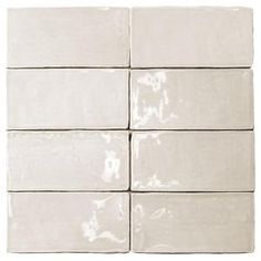 six white tiles are stacked on top of each other in the same square pattern,