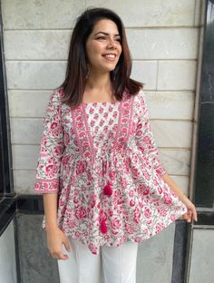 White and Pink Floral print cotton top, square neck , 3/4th sleeves featuring stylish tie ups , Jaipuri handblock print top is pleasing and  cotton becomes softer with every wash. Handmade in India with love .  Model is wearing size M. Also available in  S,M,L,XL,XXL Size chart in IMAGES. Handmade Tops Aesthetic, Stylish Shirt For Women, Kurta Style Top For Women, Cotton Top For Women, Square Neck Cotton Top, Pink Short Kurti With Jeans, Small Kurti Designs, Plus Size Cotton Tops, Short Printed Kurti