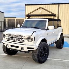 a white truck parked in a parking lot