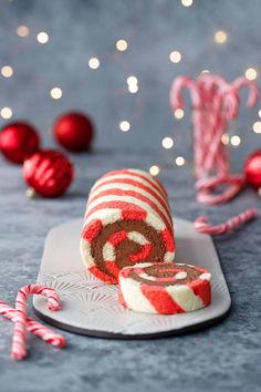 a peppermink roll on a plate with candy canes