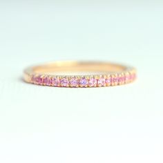 18K Yellow Gold Pink Sapphire Ring, 3/4 Eternity Ring, Natural Pink Sapphire Wedding Band, 1.5mm Half Eternity Band, Micro Pave Wedding Ring ♥ Details Handmade to order * Genuine Pink Sapphire Band in 3/4 eternity * Gemstone type: Natural Pink Sapphires * Total Carat Weight: 0.44 carats * Sapphire size: 1.5mm each * Sapphire Cut: Round Brilliant fully Faceted Diamond Cut * Metal: Solid 18K Gold (available in 14K and 18K White, Yellow, and Rose Gold, and 950 platinum) * Ring size: US 3-10 (Please Pink Sapphire Half Eternity Ring With Round Cut, Pink Sapphire Eternity Ring, Luxury Pink Sapphire Eternity Band, Elegant Pink Sapphire Round Eternity Band, Pave Wedding Ring, Pink Sapphire Wedding Band, Micro Pave Band, Pink Sapphire Band, Pave Wedding Rings