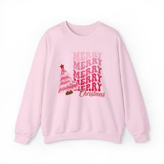 Cute girly Christmas sweater, feminine Christmas sweater, Unisex Heavy Blend™ Crewneck Sweatshirt, pretty Christmas sweater, pink Christmas sweater, merry Christmas sweater Ideal for any situation, a unisex heavy blend crewneck sweatshirt is pure comfort. These garments are made from polyester and cotton. This combination helps designs come out looking fresh and beautiful. The collar is ribbed knit, so it retains its shape even after washing. There are no itchy side seams on these sweaters.  .: Made with a medium-heavy fabric blend of 50% cotton and 50% polyester (8.0 oz/yd² (271.25 g/m this sweatshirt feels cozy and is the perfect choice for those colder months. .: The classic fit along with the crew neckline deliver a comfy wearing experience with a clean-cut style. Meanwhile, the double Pink Letter Print Sweater For Winter, Pink Letter Print Top For Winter, Winter Pink Top With Letter Print, Pink Tops With Letter Print For Winter, Pink Letter Print Sweatshirt For Winter, Pink Sweatshirt With Letter Print For Winter, Pink Cotton Holiday Sweatshirt, Cute Pink Sweater With Letter Print, Cute Pink Letter Print Sweater