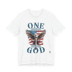 Wear your faith and patriotism boldly with our "One Nation Under God" patriotic T-shirt. It features a striking design of an American Bald Eagle, a Cross, and the iconic American flag. Crafted from Bella Canvas 3001 T-shirt blanks, this premium garment offers unmatched comfort and style. The symbolic design embodies the unity of faith and national pride, with the Bald Eagle symbolizing strength and freedom standing behind the Cross, a testament to our nation's foundation on Christian principles. Independence Day American Flag T-shirt, White Americana Letter Print T-shirt, American Style Flag Print T-shirt For 4th Of July, Patriotic Made In Usa T-shirt For Memorial Day, Patriotic Flag Print T-shirt For 4th Of July, Patriotic T-shirt For Memorial Day, Made In Usa, Patriotic T-shirt With Flag Print For 4th Of July, Patriotic T-shirt Made In Usa For Memorial Day, Americana T-shirt With American Flag For 4th Of July