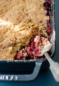 a close up of a pie in a pan with a spoon