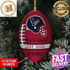 a football ornament hanging from a christmas tree with the name and number on it