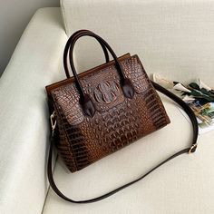 Add a touch of luxury to your outfit with the Elegant European Style Crocodile Pattern Women Bag! Featuring a stunning crocodile texture, this sophisticated handbag combines European elegance with timeless style. Perfect for both casual and formal occasions, this bag exudes class and confidence. 🌟💼

🔥 Key Features:
🐊 Stylish crocodile pattern for a luxurious look
🌟 Elegant European design
👜 Spacious interior for all your essentials
🎨 Perfect for day-to-night transitions

#CrocodilePatternBag #LuxuryHandbag #EuropeanStyle #ElegantAccessories #TimelessFashion #ChicAndClassy #StatementBag #WomenFashion #SophisticatedStyle Leather Bags Women, Bag Shapes, Shopping Tote Bags, Crocodile Handbags, Designer Leather Bags, Purse Style, Men Handbags, Brand Handbags, Retro Bags