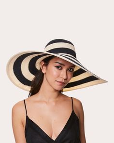 Accessorize your next sun-soaked outing with the Sunny hat, a floppy, wide-brim topper detailed with chic black stripes. A discreet inner band is easily adjustable for a perfect fit. UPF 30+ Inner adjustable band 57% paper, 29% polyester, 14% polypropylene Spot clean Made in Taiwan Measurements Crown circumference: 22.5in Sustainability Metrics: Circular Economy: product is intentionally designed with 50% of actively cycled materials Clean ingredients: 100% of materials used are natural ingredie Summer Striped Brimmed Straw Hat, Summer Brimmed Striped Straw Hat, Summer Striped Wide Brim Hat, Striped Brimmed Straw Hat For Summer, Striped Flat Brim Hat For Summer, Striped Wide Brim Summer Hat, Striped Fedora Straw Hat For Vacation, Striped Curved Brim Straw Hat For Summer, Striped Brimmed Straw Hat For Vacation