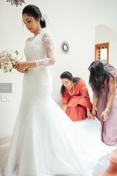 the bride is getting ready to walk down the aisle