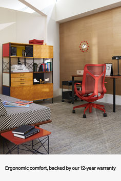 an office with a desk, chair and bookcase on the wall next to it