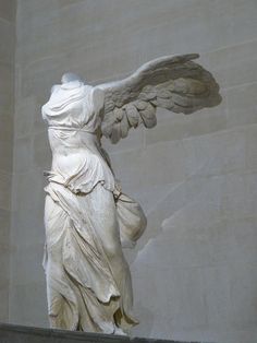 an angel statue in front of the lincoln memorial