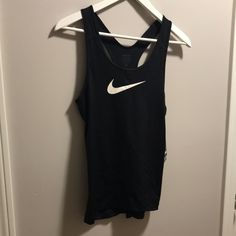 Great Condition Nike Black Elastane Activewear, Black Elastane Tops For Workout, Black Elastane Workout Top, Black Stretch Racerback Top, Sporty Black Elastane Tank Top, Black Elastane Tops For Training, Nike Black Sleeveless Top, Black Tank Top For Sports, Black Elastane Sports Top