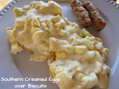 an image of a plate of food with eggs and sausages on it that says southern creamed eggs over biscuits