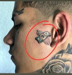 a man with a tattoo on his neck has a red circle in front of him