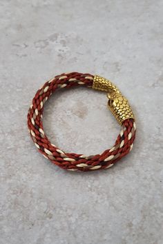 Gold and Brown Snake Bracelet A beautiful golden, snake pattern bracelet hand woven with vegan friendly rattail silk in copper, coffee, pale gold and chocolate brown and finished with a gold coloured Snake Head Ouroboros style clasp. Eye catching and unusual. This statement bracelet will definitely get you noticed.  📏 18cm/7" Not adjustable but will stretch slightly.   Snake bracelets are best if they fit fairly snugly. Order 2cm to 3cm longer than actual wrist size.  I may be able to adjust th Japanese Braiding, Serpent Jewelry, Golden Snake, Pattern Bracelet, Snake Head, Brown Snake, Snake Pattern, Snake Bracelet, Snake Patterns