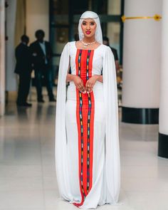 This elegant Oromo dress, inspired by the beauty of Oromo traditional dress, features a striking red design that highlights its unique and shapely silhouette. Perfect for special occasions, this dress combines traditional cultural elements with modern style, celebrating the rich heritage of the Oromo people. Material Cotton Thread Estimated delivery : 1 week to 2 weeks Contact WhatsApp +1(304)-306-2784Email: contact@ethiopian.store Red Traditional Pattern Maxi Dress, Red Maxi Dress With Traditional Patterns, Red Dresses With Traditional Patterns For Ceremonies, Elegant Red Maxi Dress For Traditional Ceremonies, Elegant Red Dress With Traditional Patterns, Oromo People, Cultural Celebration, Red Design, Caicos Islands