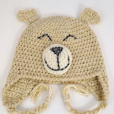 a crocheted hat with a bear's face on it