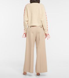 Wool sweater in beige - Victoria Beckham | Mytheresa Spring Merino Wool Cable Knit Sweater, Spring Cable Knit Merino Wool Sweater, Spring Wool Knitted Sweater, Spring Wool Cable Knit Sweater, Victoria Beckham Outfits, Beige Sweater, Sweater Fashion, Bright Orange, Wool Sweater