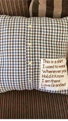 a pillow with a message on it sitting next to a striped pillow case that says, this is a shirt i used to wear whenever you hold it know i am there