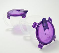 two pieces of purple plastic sitting next to each other on top of a white surface