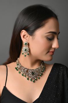 Kundan Polki Set, Emerald Diamond Set, Statement Jewelry, American Diamond Set, Sabyasachi Jewelry, Emerald Cubic Zirconium Necklace Set Green Stones Gold Plated Necklace with Earrings. Elegant Indian Beaded Necklace featuring green stones in this regal necklace. This beautifully handcrafted necklace is set in silver and copper alloy and plated with 22k gold. PRODUCT DETAIL: * Necklace Length: 17 inches (comes with adjustable Dori/sarafa/cord) * Earrings Length: 2.5 inches approx * Material: Brass and stone * Package: Necklace And Earring  STYLE TIP: Perfect for weddings or banarasi and zari sarees. This is a perfect match for your pastel wedding dresses and floral gowns. A perfect companion for pastel lehengas and Indian wedding dresses. ABOUT US: Jaipri makes each piece of its product by Indian Choker Necklace Set, Necklace Choker Gold, Indian Wedding Necklace, Cord Earrings, Jewelry Indian Wedding, Sabyasachi Jewelry, Bridal Indian, Indian Choker Necklace, Indian Choker