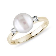 a pearl and diamond ring in yellow gold