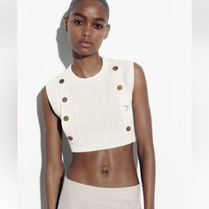 Rand New. Round Neck Cropped Top. Front Gold False Buttons White Crop Top For Summer Workwear, White Crop Top For Workwear In Summer, Chic Cropped Neutral Tops, Chic Neutral Cropped Tops, Chic White Ribbed Knit Top, Casual White Crop Top For Work, White Knit Crop Top With Crew Neck, Chic White Crew Neck Crop Top, White Ribbed Knit Top For Work