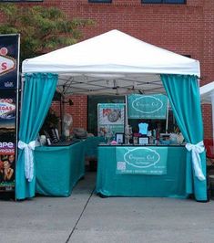 an outdoor tent set up on the sidewalk