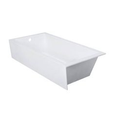 a white bath tub sitting on top of a counter