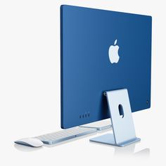 an apple desktop computer with a keyboard and mouse on it's side, in front of a white background