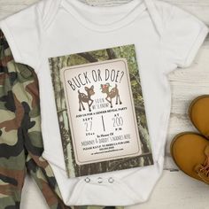 a baby's bodysuit with an image of two deers on it and the words buck or doe