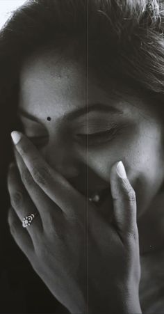 black and white photograph of a woman holding her hands to her face with both hands