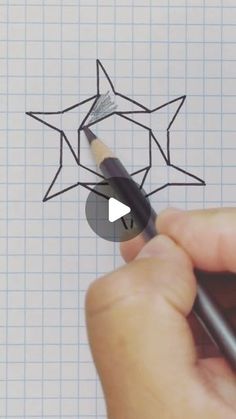 someone is drawing a star with a pencil