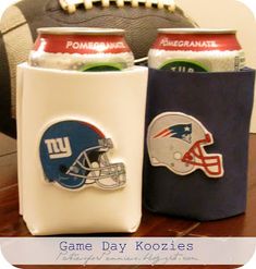 two can coolers with new york giants and football helmets on them sitting on a table