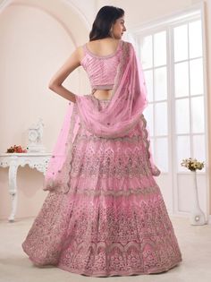 A masterpiece that combines elegance, beauty, and tradition. This pink color lehenga crafted from high-quality net material will make any woman feel like a princess on her special day.
The lehenga is embellished with exquisite embroidery work, sequin work, dori, and zari work, adding a touch of glamour and sophistication. The intricate detailing creates a mesmerizing pattern, making this lehenga a true work of art.
To complete the ensemble, the lehenga comes with a matching net blouse material i Embroidered Bridal Lehenga, Engagement Lehenga, Bridesmaid Lehenga, Choli Blouse, Pearl Work, Bridesmaid Attire, Net Blouses, Salwar Dress, Dress Salwar Kameez